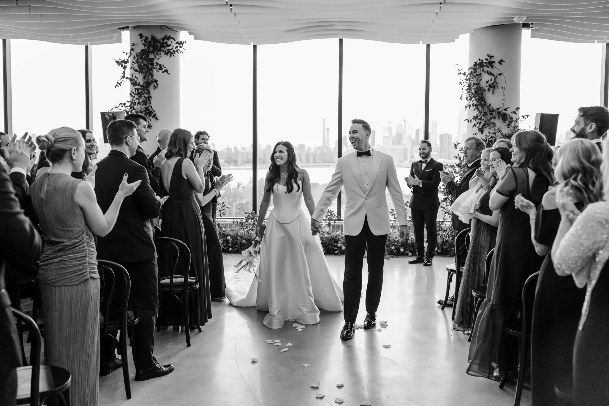 A couple's wedding day at VESPER with sweeping waterfront and city skyline views in Williamsburg