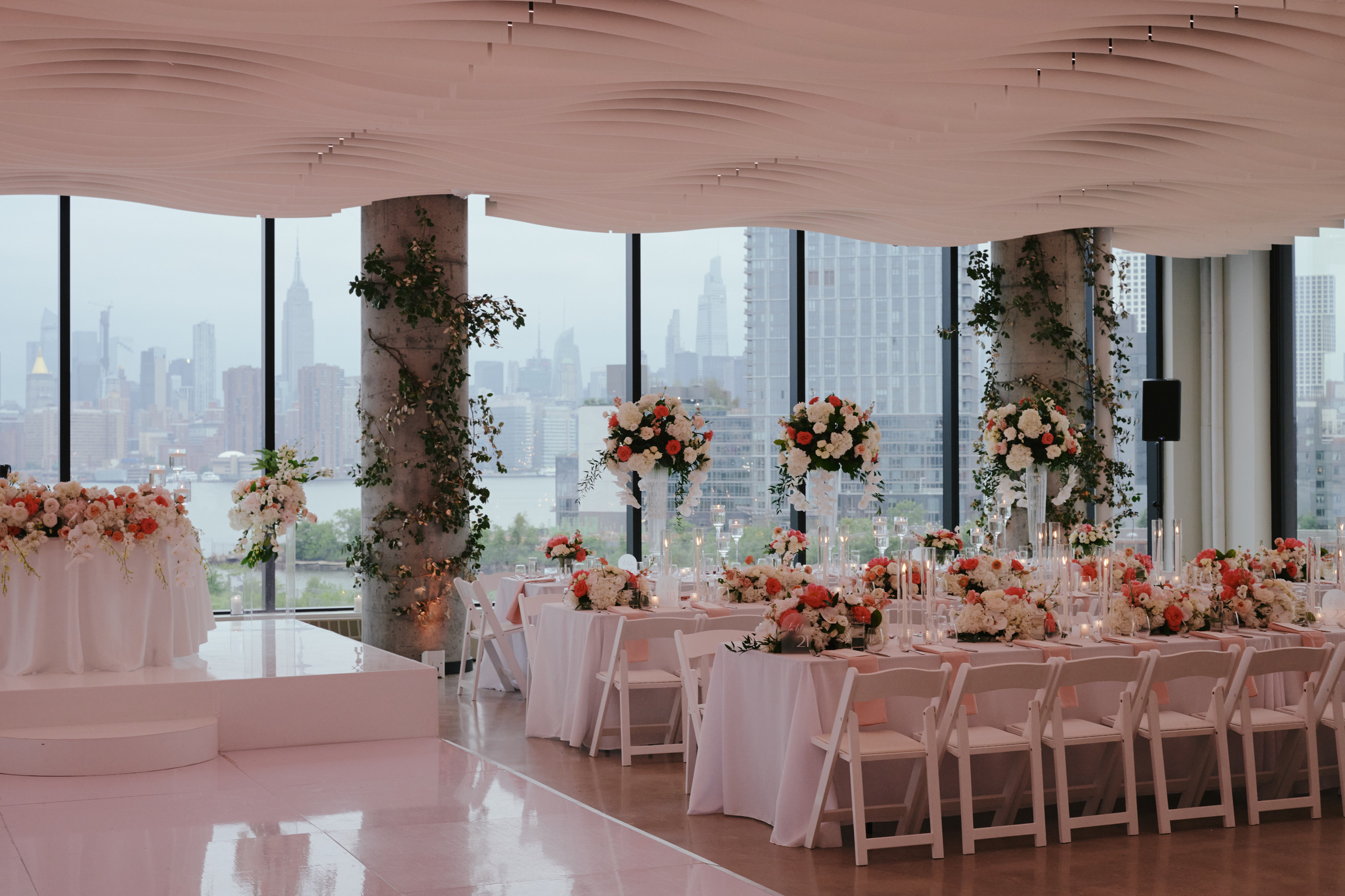 Manhattan skyline at night through VESPER's panoramic windows in Brooklyn — a cinematic production backdrop