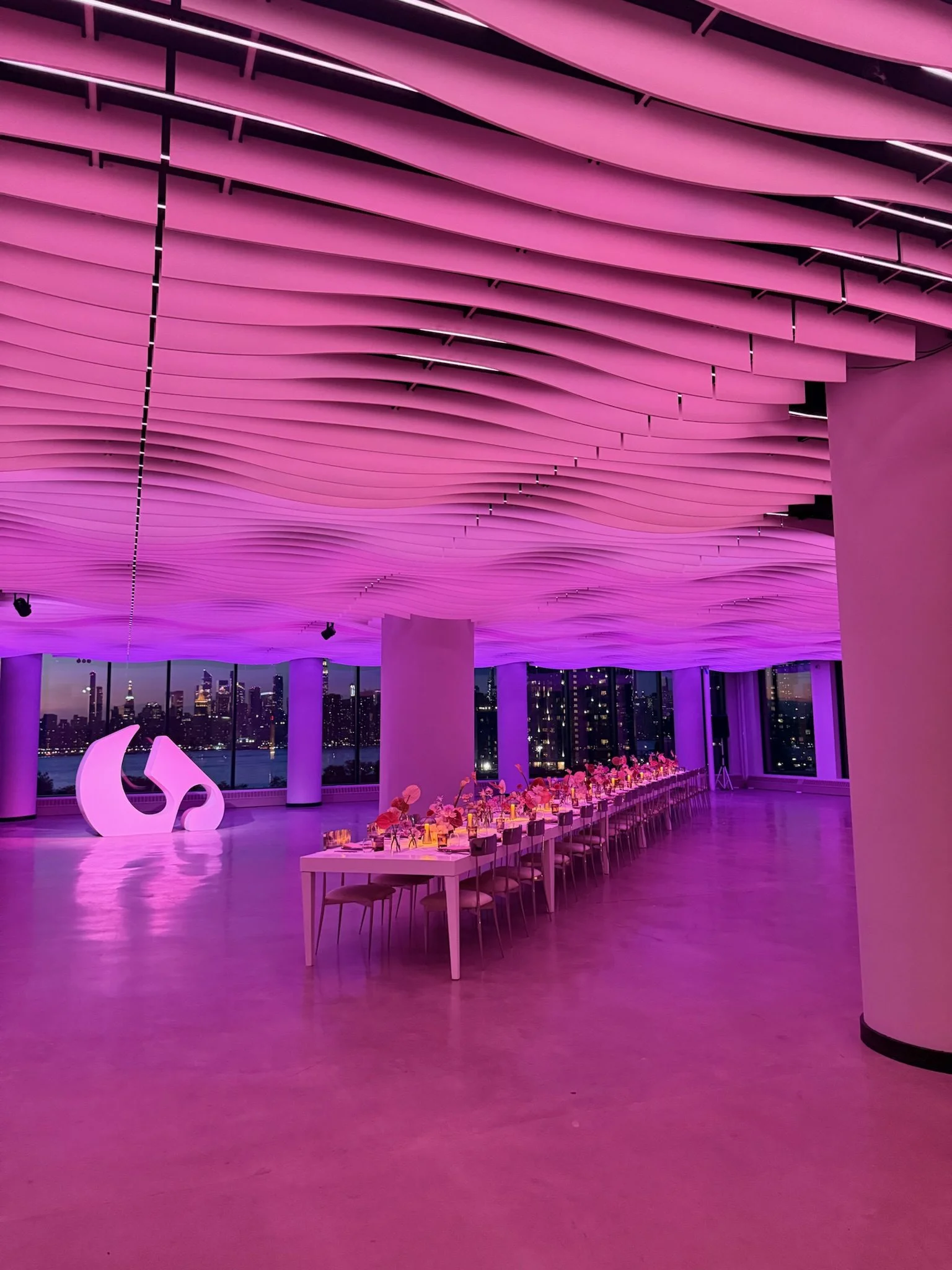 Brand activation with dramatic pink lighting at VESPER's Williamsburg event venue