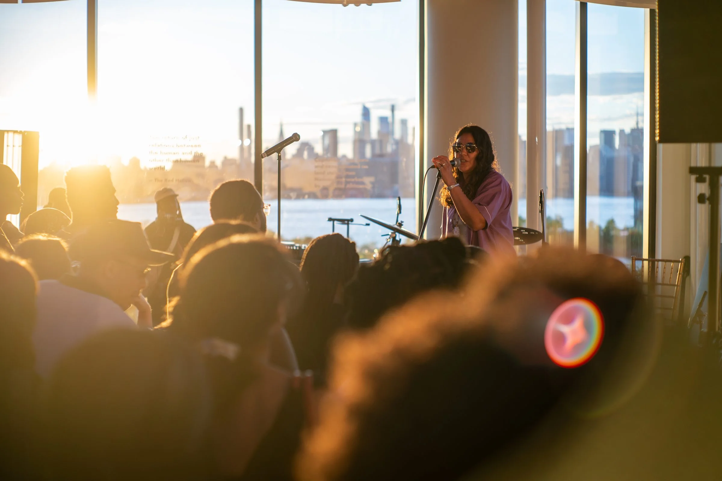 Concert at a corporate event at VESPER during golden hour with the NYC skyline in Brooklyn