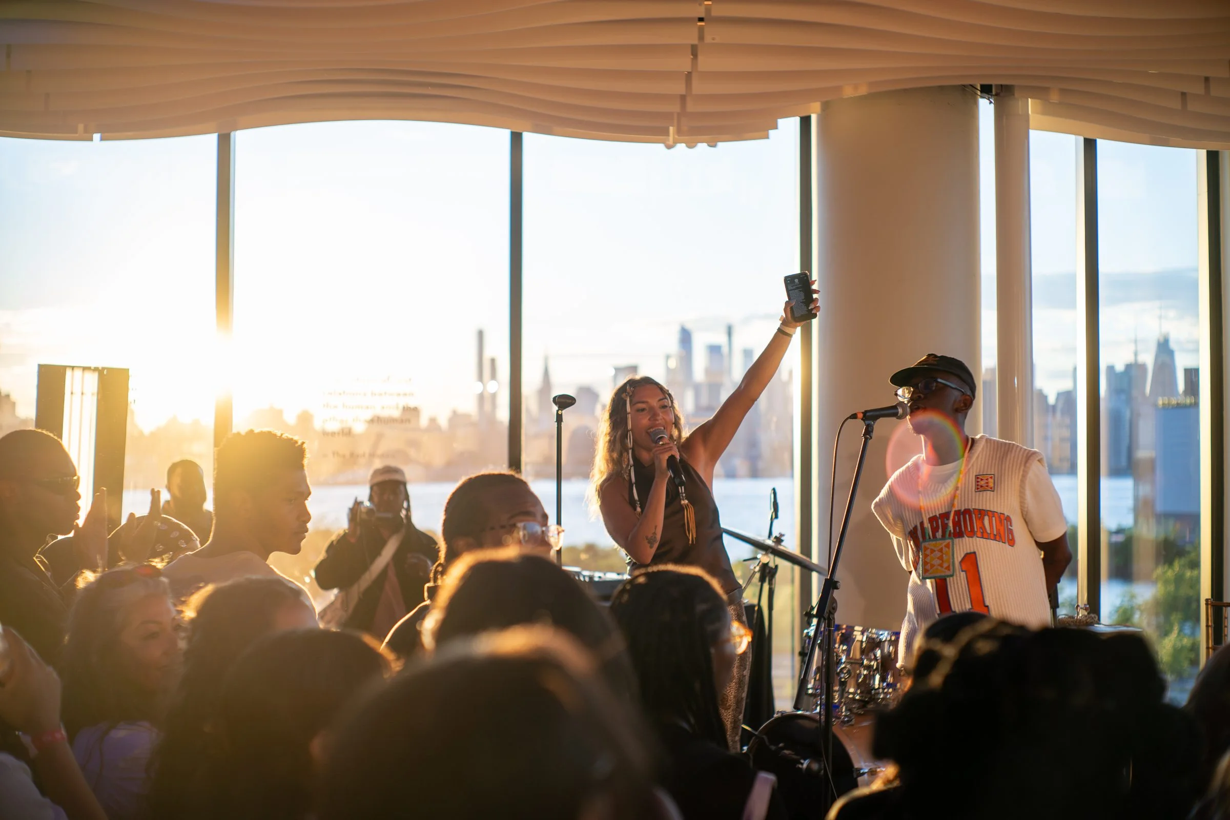 Live performance at a corporate event on the VESPER rooftop at sunset with the Brooklyn skyline