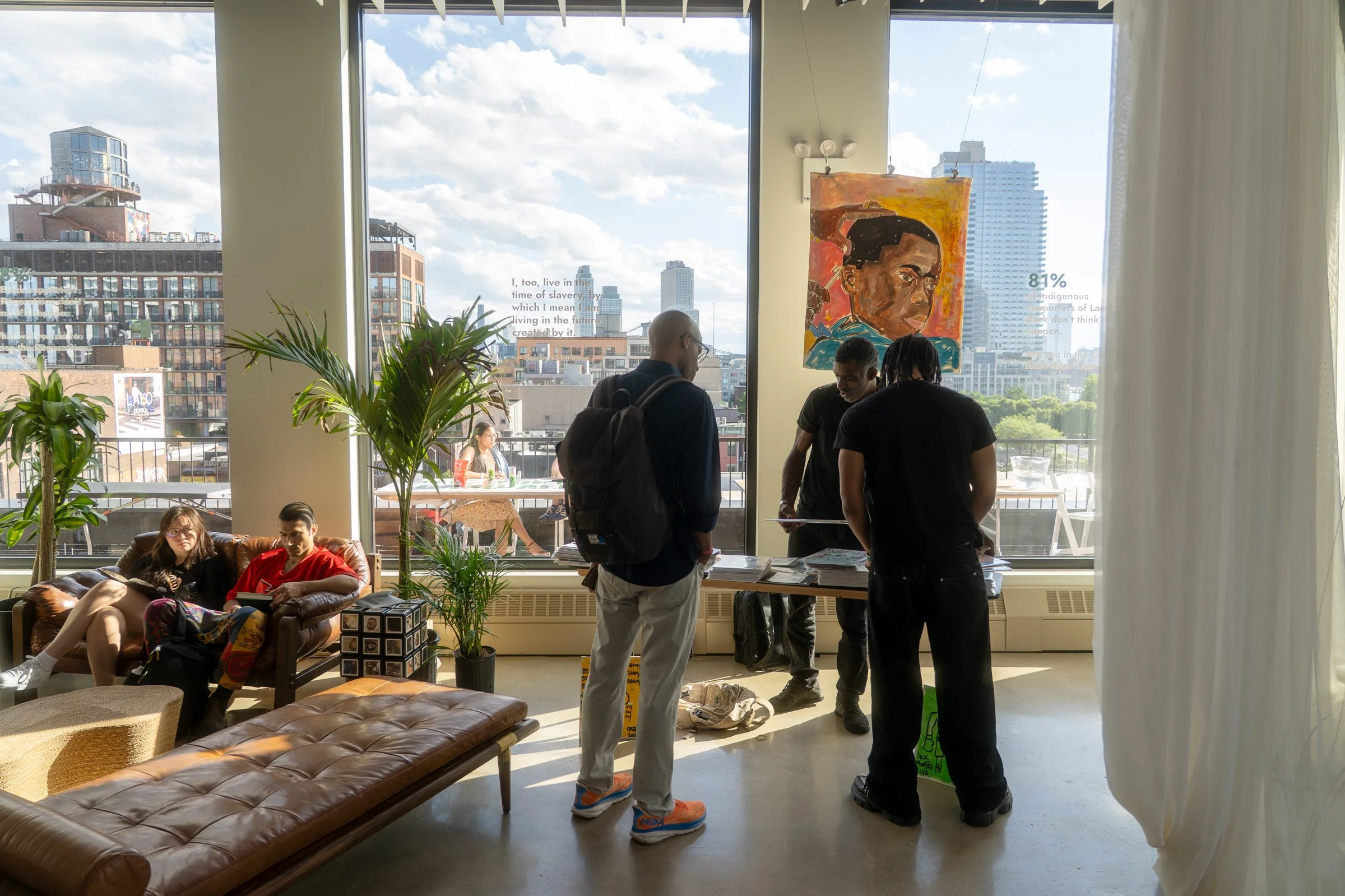 Corporate event at VESPER with an art showcase and the Manhattan skyline through floor-to-ceiling windows in Brooklyn