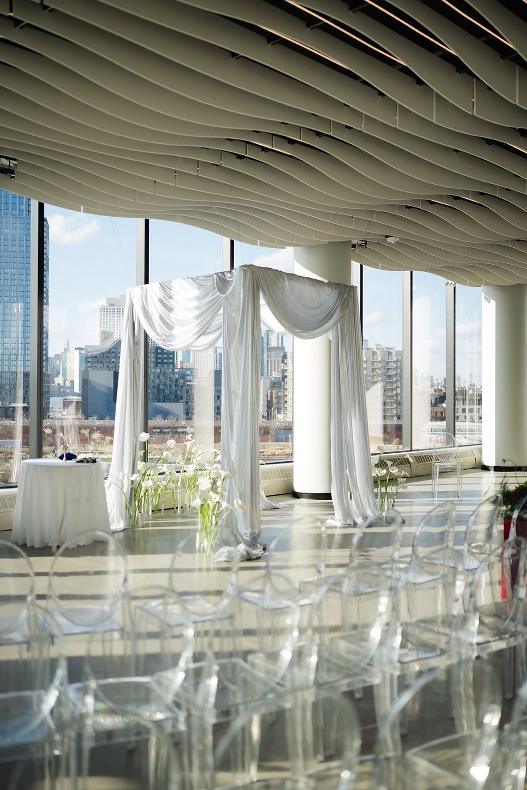 Draped floral arch wedding ceremony setup at Vesper Events venue in Williamsburg, Brooklyn