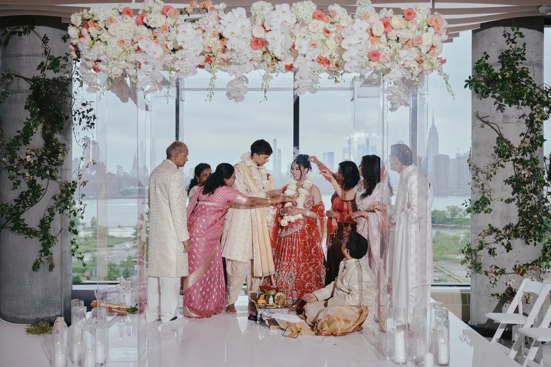 Wedding ceremony under a floral mandap with the Manhattan skyline at VESPER